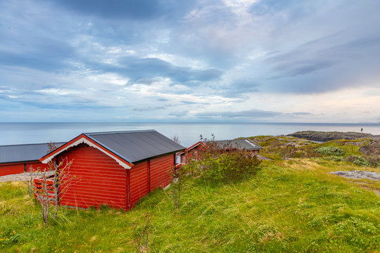 Traditional red camping houses with a beautiful sea view next to village A, lofoten, Norway