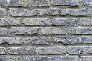 Old gray brick wall texture.