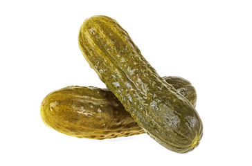 Two marinated pickled cucumbers isolated on white background