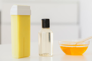 Wellness Products and Cosmetics. Herbal and mineral skincare. Jar of cream, white cosmetic bottles. Without label. Spa Set with soap and white towe