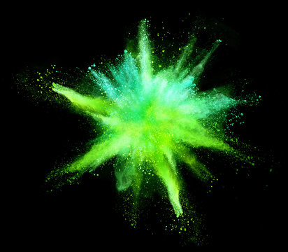 Explosion of coloured powder on black background