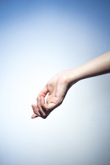 Woman hand on blue background