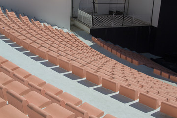 stone seats in the outdoor stadium as in the amphitheatre