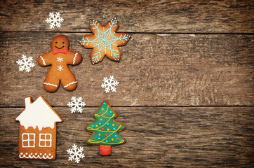 Gingerbread cookies over wooden background