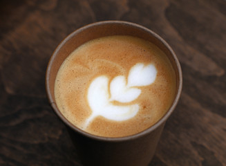 Latte cappuccino coffee in brown paper cup