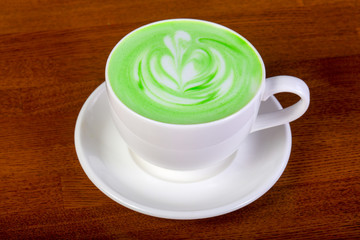 Green cappuccino with cream