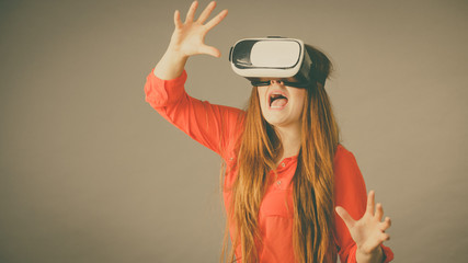 Girl wearing virtual reality goggles.