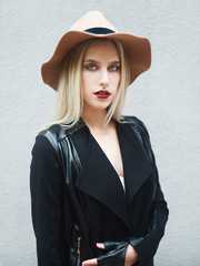 Young woman wearing jacket and hat