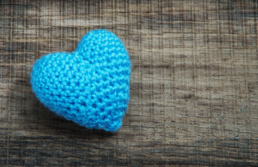 blue heart shape on wood background