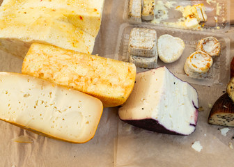 a large assortment of cut cheese heads, marble cheese