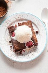 Raspberry chocolate brownies with vanilla ice creams 