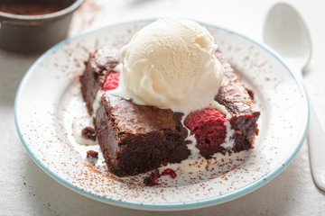 Raspberry chocolate brownies with vanilla ice creams 
