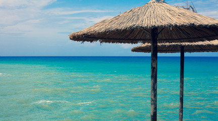 Focused Sun Lids Over Beautiful Coastline with a Gorgeussea blurring into the sky. Amazing beach with a astonishing blue ocean background. Breezy  Sunny day of the summer.