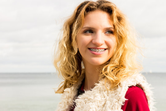 Happy Woman Outdoor Wearing Fur Vest