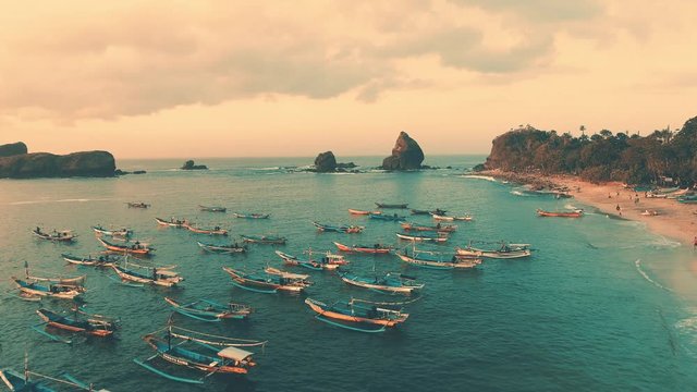 Indonesia traditional fishing boats docked in shores after fishing an aerial view, Papuma beach Jember