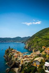Vertical View of the Town of Vernazza on blue Sea and the Coastline of the Liguria Background.
