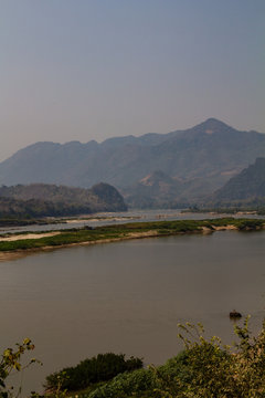 A mahout washing his elephant in the Mekong river in the people's republic of Laos