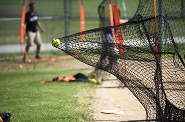Yellow Ball Goes Into Batters Practice Net