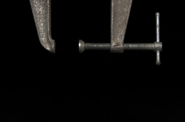 Old Rusted C-Clamp On Black Background