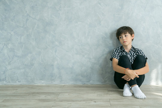 Sad boy at home and unhappy. Problems at family.