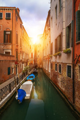 Fototapeta na wymiar View of the street canal in Venice, Italy. Colorful facades of old Venice houses. Venice is a popular tourist destination of Europe. Venice, Italy.