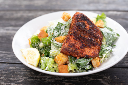 Close up on  a blackened salmon Caesar salad