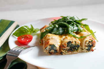 Cannelloni with spinach, cheese and bechamel sauce.
