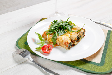 Cannelloni with spinach, cheese and bechamel sauce.
