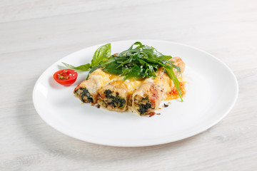 Cannelloni with spinach, cheese and bechamel sauce.
