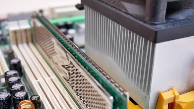 Installing random access memory RAM into motherboard