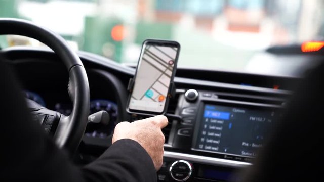 Uber driver use navigating on smartphone