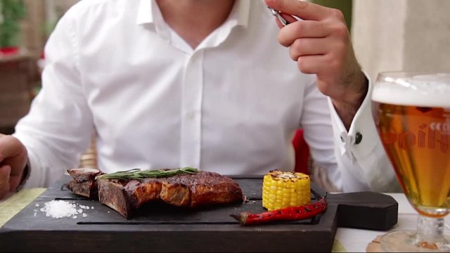 Serving steak in a restaurant. Black Angus