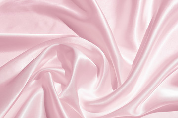 The texture of the satin fabric of pink color for the background 