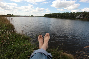 summer scene by the river with elongated legs