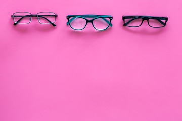 Glasses concept. Set of glasses with different eyeglass frame and transparent lenses on pink...