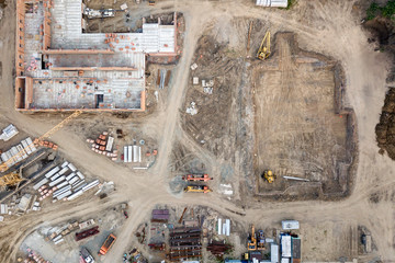 Aerial view:Construction of residential multi-storey houses with the help of a construction crane,...
