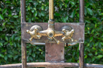Vintage bronze shower faucet of hot and cold water