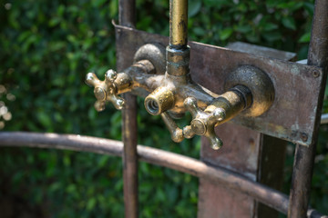 Vintage bronze shower faucet of hot and cold water