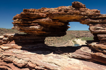 Nature's Window, a natural, wind eroded, sandstone rock in the Kalbarri National Park. The view through the window is of the Murchison River running through its gorge. Western Australia.