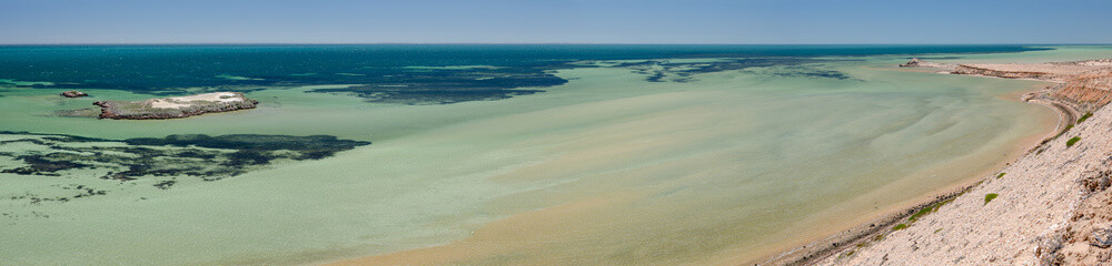 Fototapeta premium Panoramic view from Eagle Bluff lookout at the wide, shallow, sandy bay. Eagle Island in the middle distance. Western Australia.
