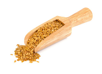 Golden flax seeds on a white background