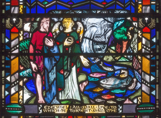 LONDON, GREAT BRITAIN - SEPTEMBER 16, 2017: The prophecy of Ezecheil over the River from the Temple on the stained glass in church St Etheldreda by Charles Blakeman (1953 - 1953).