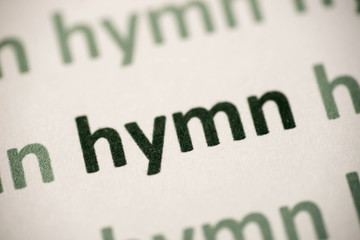 word hymn   printed on paper macro