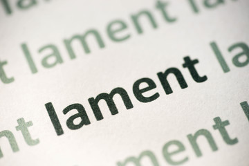 word lament  printed on paper macro