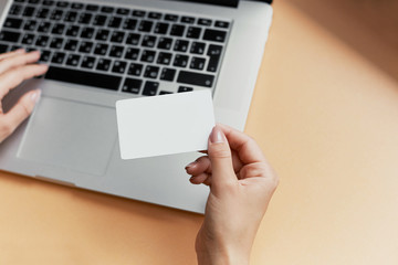 Business woman typing and making on-line payment with credit card