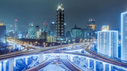 Fototapeta na wymiar aerial view of buildings and highway interchange at night in Shanghai city