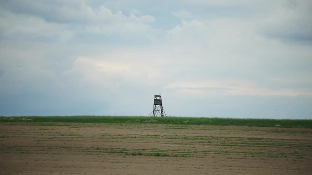 Hunting Tower on the Hill in Field