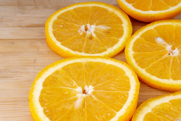 Fototapeta na wymiar Orange fruit slice. Selective focus and crop fragment