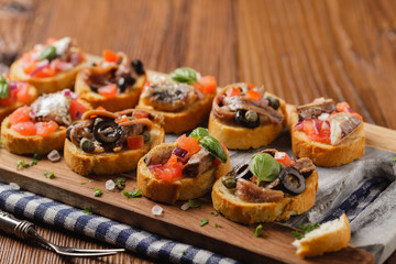Mix Bruschetta with sardines and anchovies.