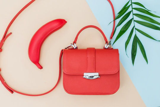 Red Fashion Bag On The Light Blue And Yellow Background